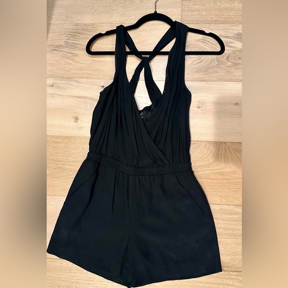 Loft xs petite black shorts romper with pockets in the front and back.